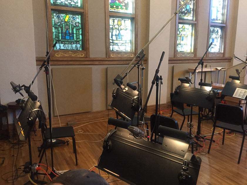 As well as microphones, each player had earphones to hear the soloists in the isolation booths.