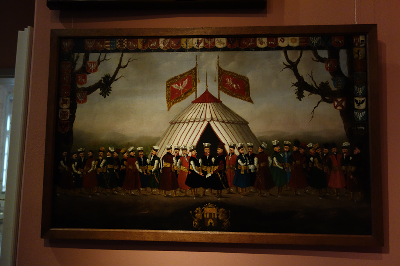 A curious painting showing a group of nobles. In the Bishop Erazma Ciolka Palace in Kraków.