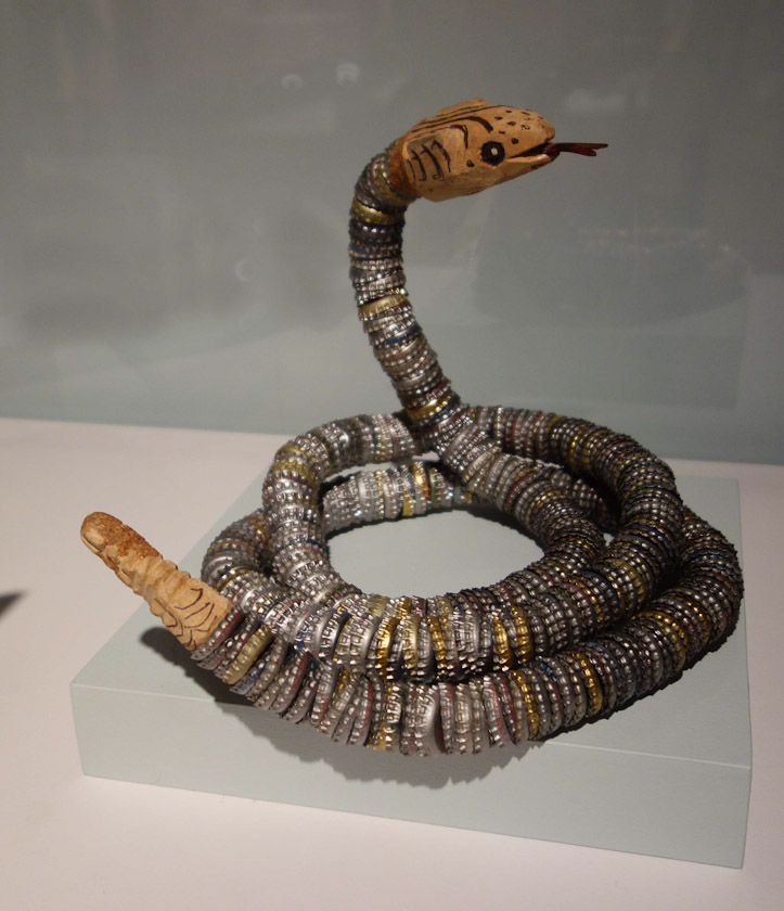 Rattlesnake (1973) by Felipe Benito Archuleta. Wood, bottle caps, ball-point pen, paint.