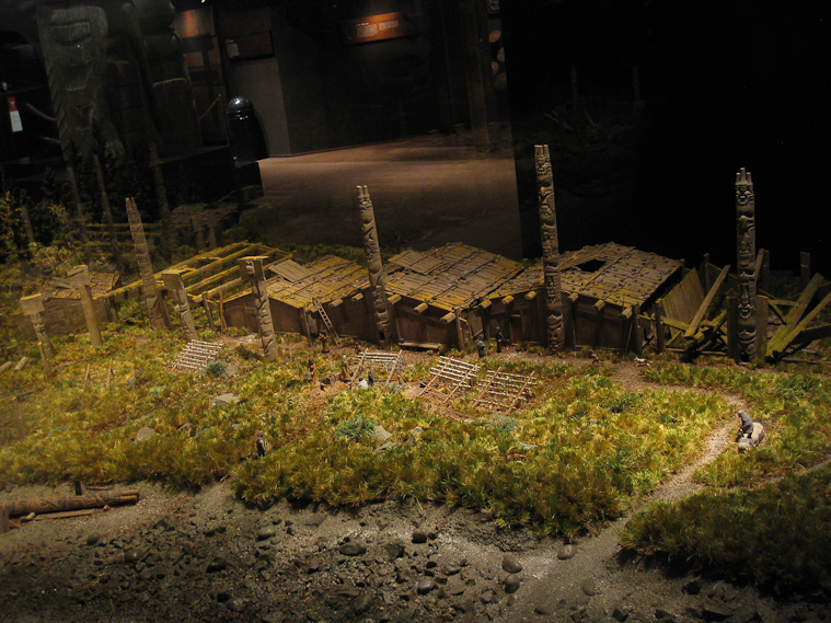 Diorama of a Northwest Indian village, partly abandoned.
