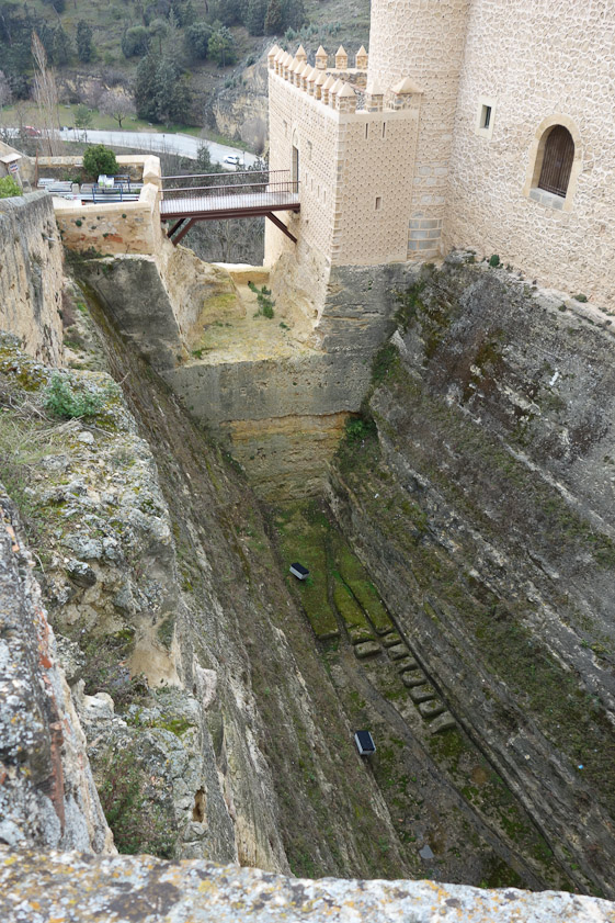 The moat is impressively deep. I expect that the stone quarried here was used to build the castle.