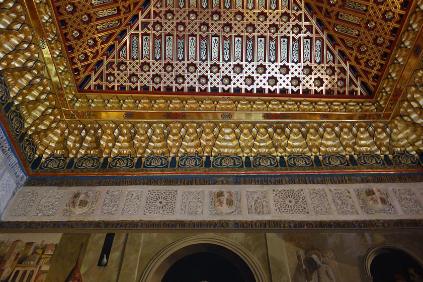 A plaster frieze is below a fabulous restored gilded and painted Mudéjar ceiling in the Galeria. The original was destroyed in a fire in 1862.
