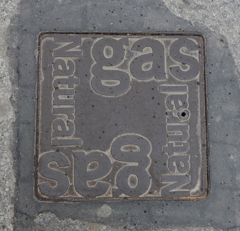 Manhole cover in Segovia. Gas Natural is the name of the gas company.