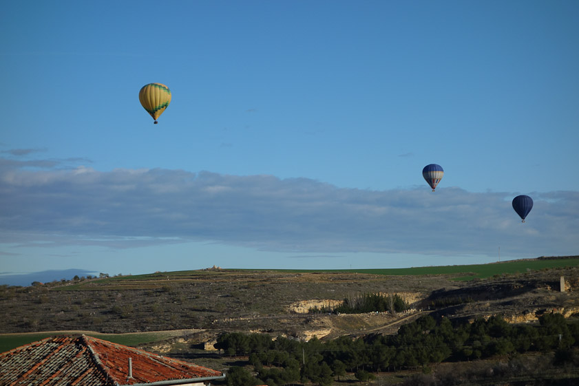 The morning we left Segovia, we had this view from our terrace of balloons flying over the city.