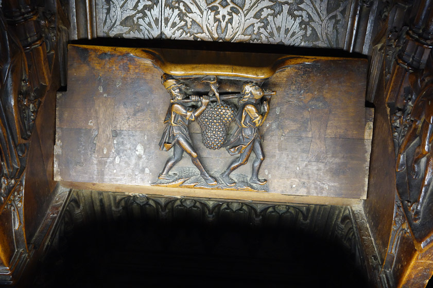 Carving under the seats in the choir.