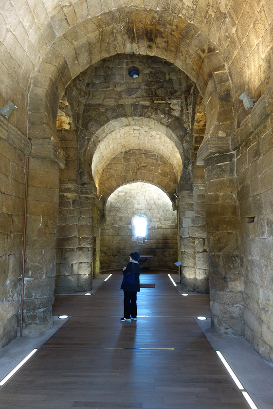 Standing just inside the west door, I shot Mariana looking into the north tramsept. Note the horseshoe arches and barrel vaults, which are Visigothic, not Islamic.