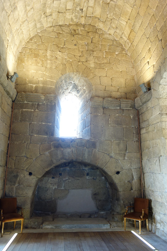 The presumed burial niche in the south transept. The smooth wood floor is modern. A Zodiaque book shows a very rough, dirt floor.