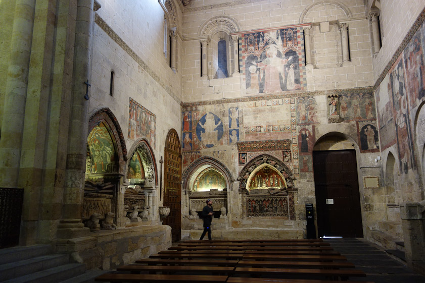 Tombs in the south transept of Salamanca Old Cathedral. The door leads to the cloister.