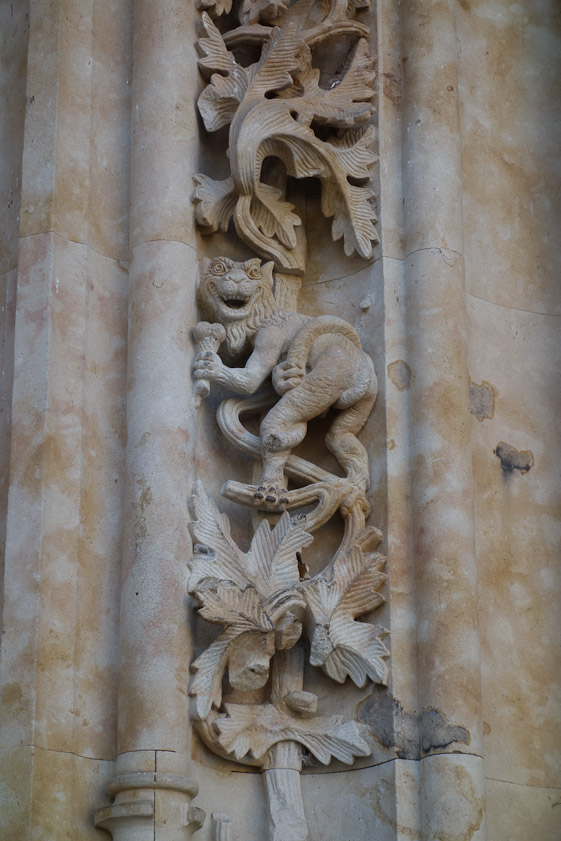 In the vertical frieze of carving to the left of the north door are some whimsical, modern figures. Here is a devil with an icecream cone.
