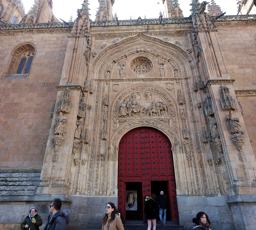 The north door is the tourist entrance to the two Salamanca Cathedrals, New (1513, Gothic) and Old (1160, Romanesque).