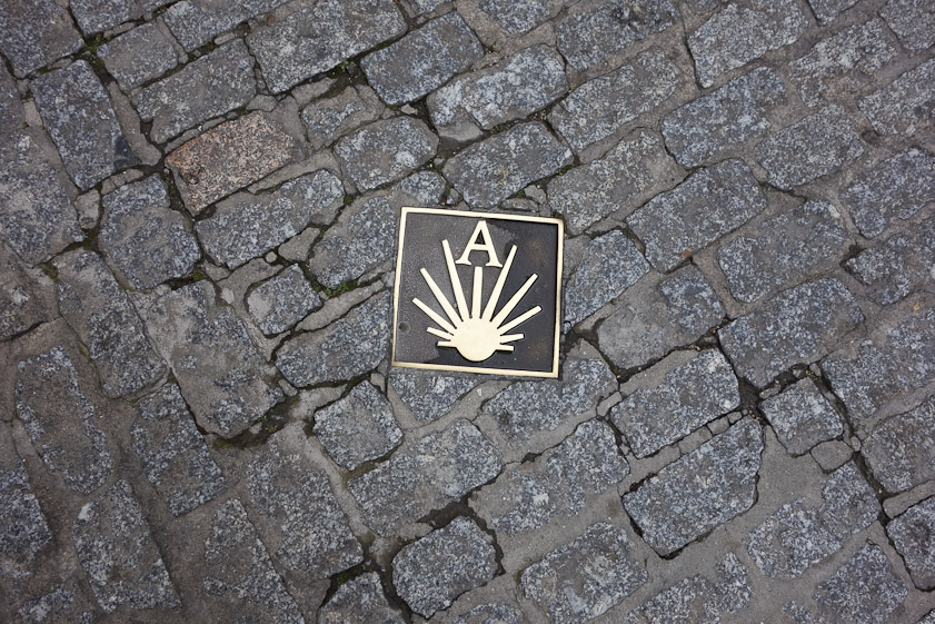 This way to Santiago de Compestela. Marker in the street in Salamanca.
