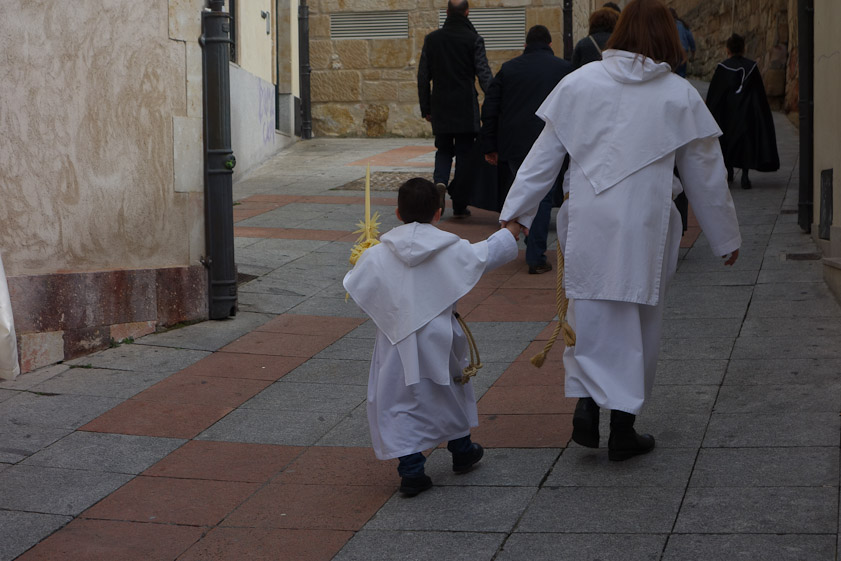Mother and son on their way to join their procession on Palm Sunday in Salamanca.