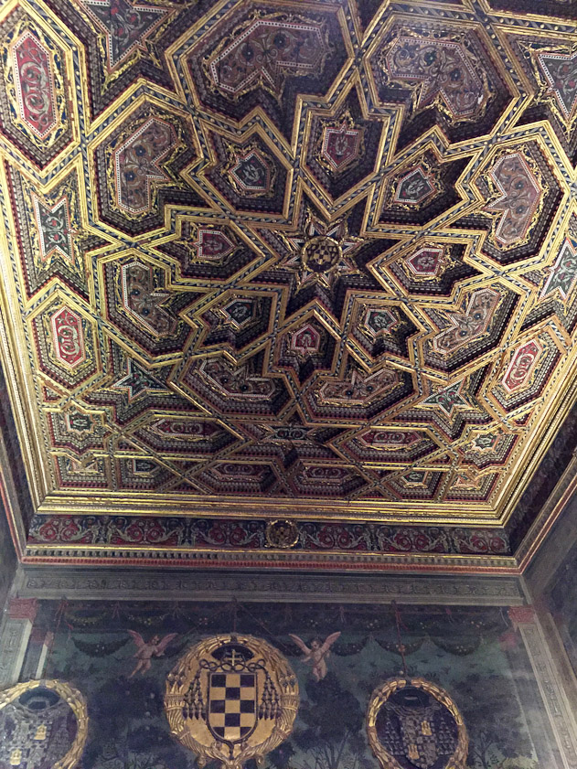 The ceiling above the portal also shows Arab geometric influence.