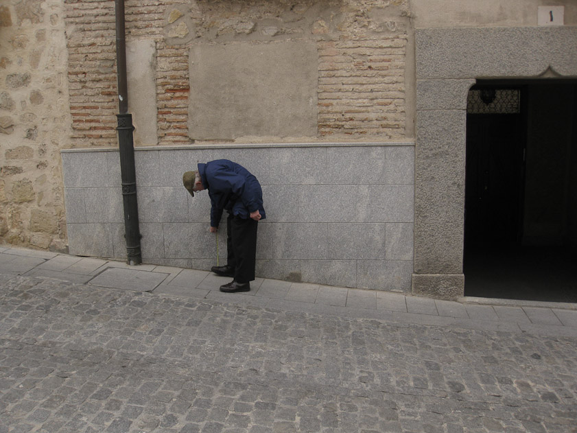 Here I'm measuring the grade of yet another steep street.