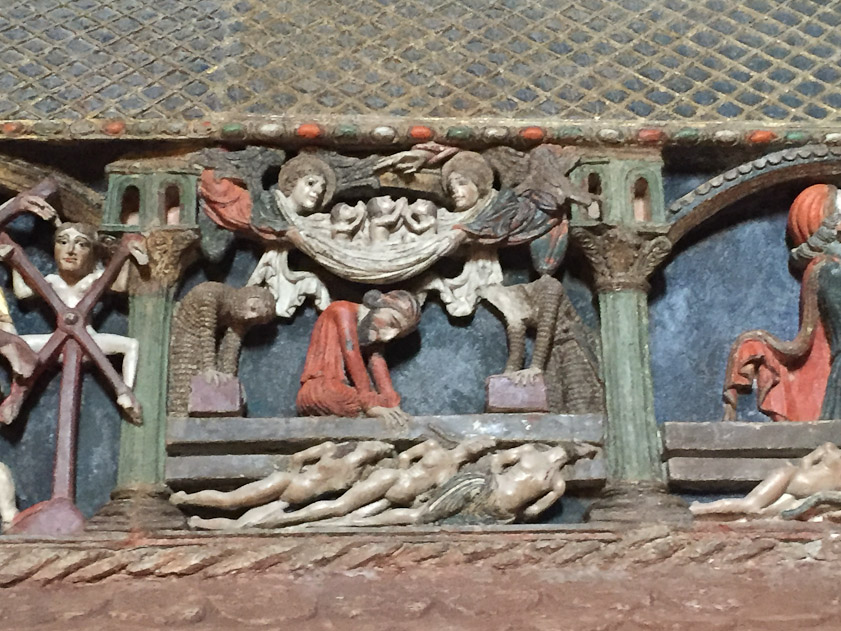 In the third scene their heads are crushed by stones pressed down by soldiers and a Jew. Two angels lift their souls to heaven where the hand of God blesses them.