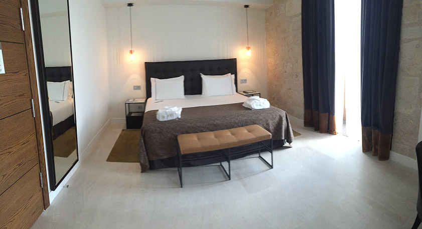 It was modern, almost stark. Reading light was inadequate in bed.