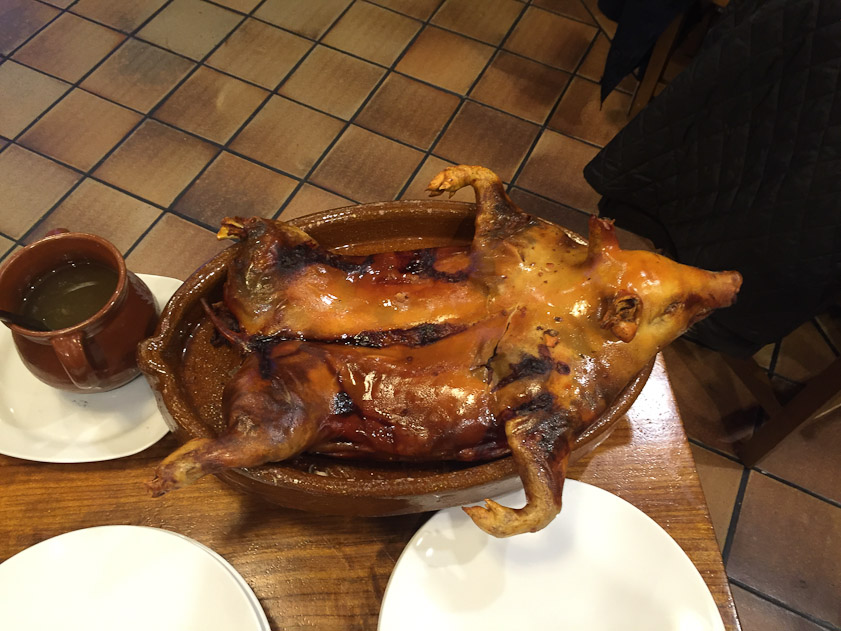 After roasting, a piglet is ceremoniously divided and served at tableside.