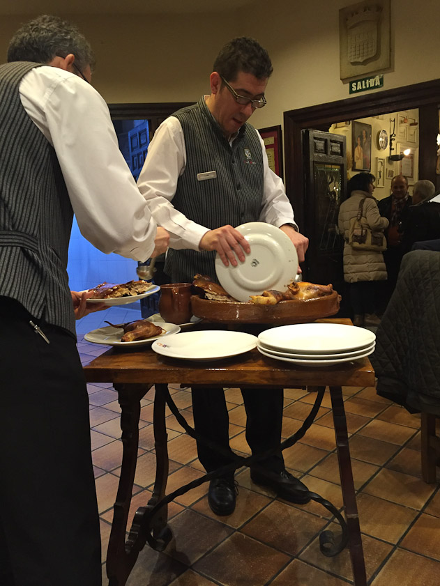The piglet is carved with the edge of a plate, demonstrating its tenderness.