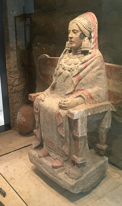 The figure served as a funerary urn for the ashes of the deceased.