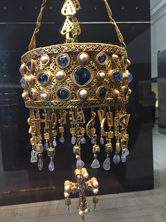 A Visigothic crown from 621-672, part of the Guarrazar Hoard, hung over altars in churches to symbolize the bond between the monarchy and divinity.