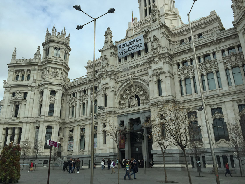 A political statement about MIddle Eastern refugees on the Palacio de Cibeles, City Hall of Madrid.