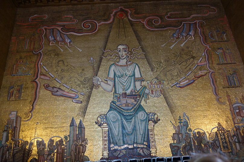 There's a lot of allegory here which I will not go into. The woman is the spirit of Stockholm.