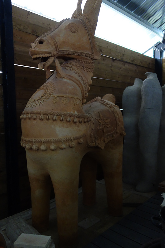 Large, hollow, earthenware figure made at a workshop for Indian-style ceramics.