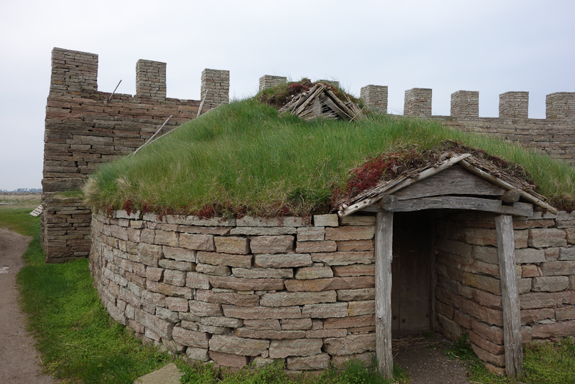 A more substantial, stone house or storehouse.