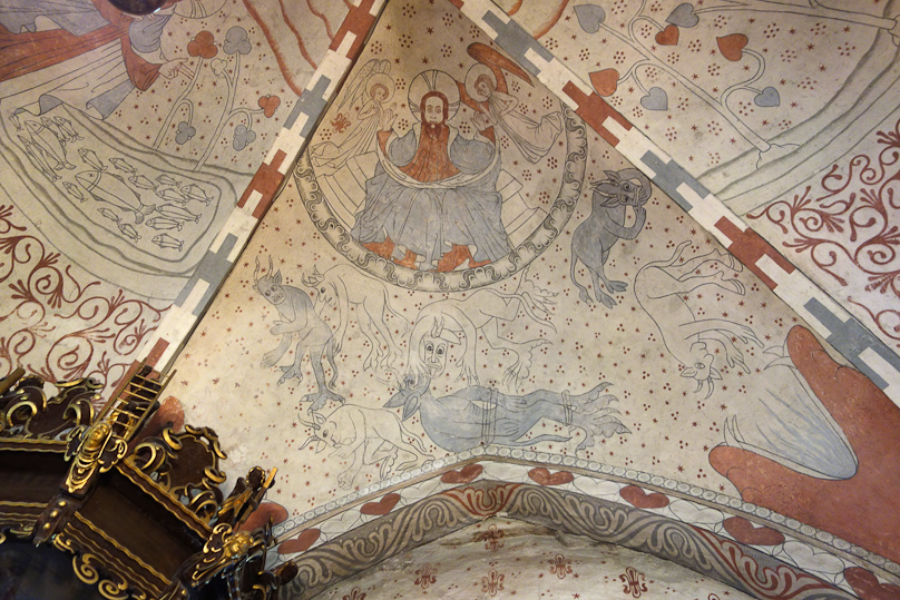 It appears that God also created monsters and devils. Note the huge, fanged mouth in the lower right corner.