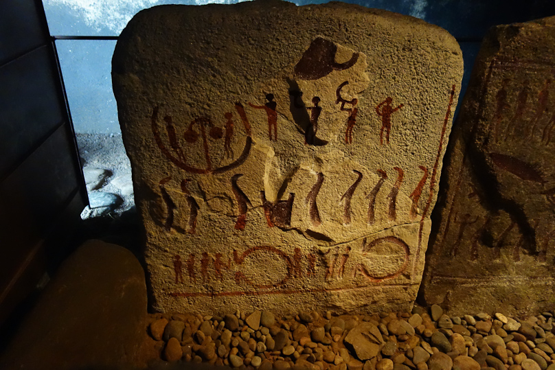 The red paint is modern, to make the inscritptions visible.