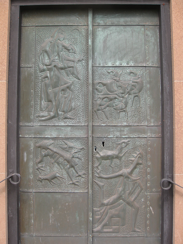 The south doors are embossed copper, with an interesting, confusing modern design.