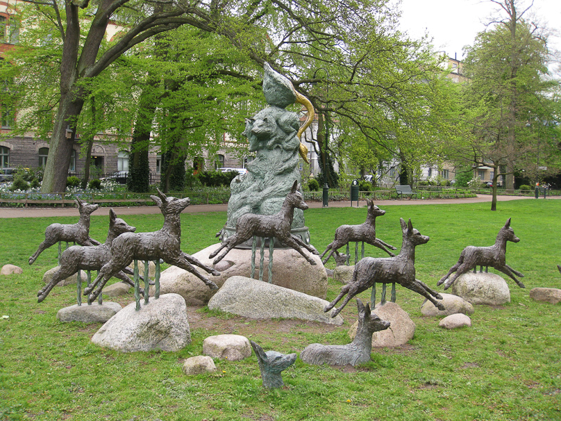 The central figure appears to be a pile of bears topped by a goose with a golden neck.