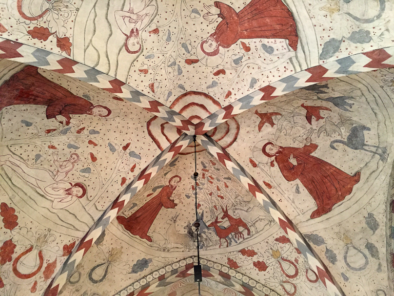 On the left, God creates Eve out of Adam's rib. In the middle He creates the animals of the land. In the right He creates the birds in the air.