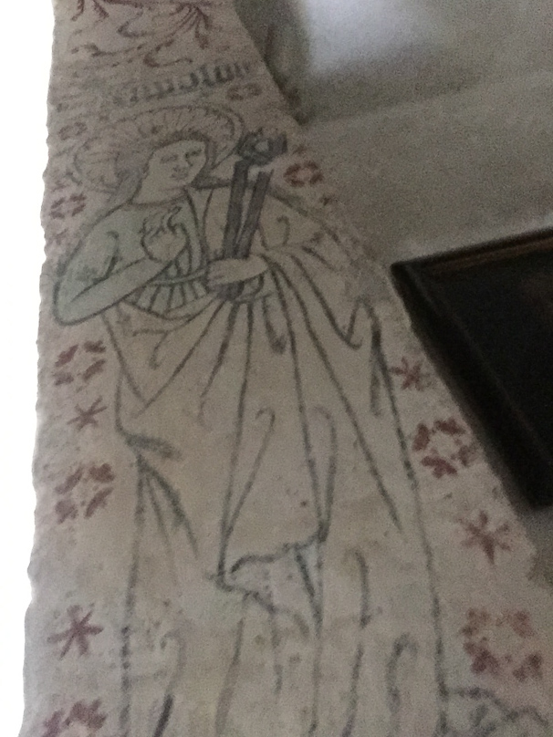 This is St. Apollonia, the patron saint of dentists. Her tongs hold a tooth she has extracted!.