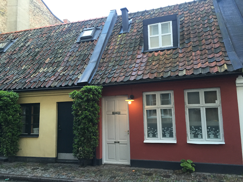 Old houses near our hotel in Malmö. Note the glass curtains with silhouettes of pots of flowers.