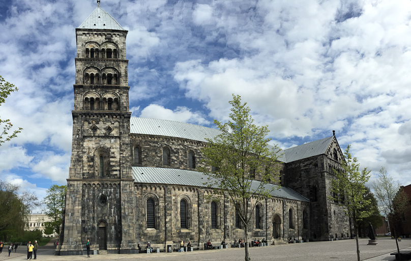 View of the south side of Lund Cathedral. It's big and sooty, and acquired this appearance during the 19c. Note: no butresses on the nave.